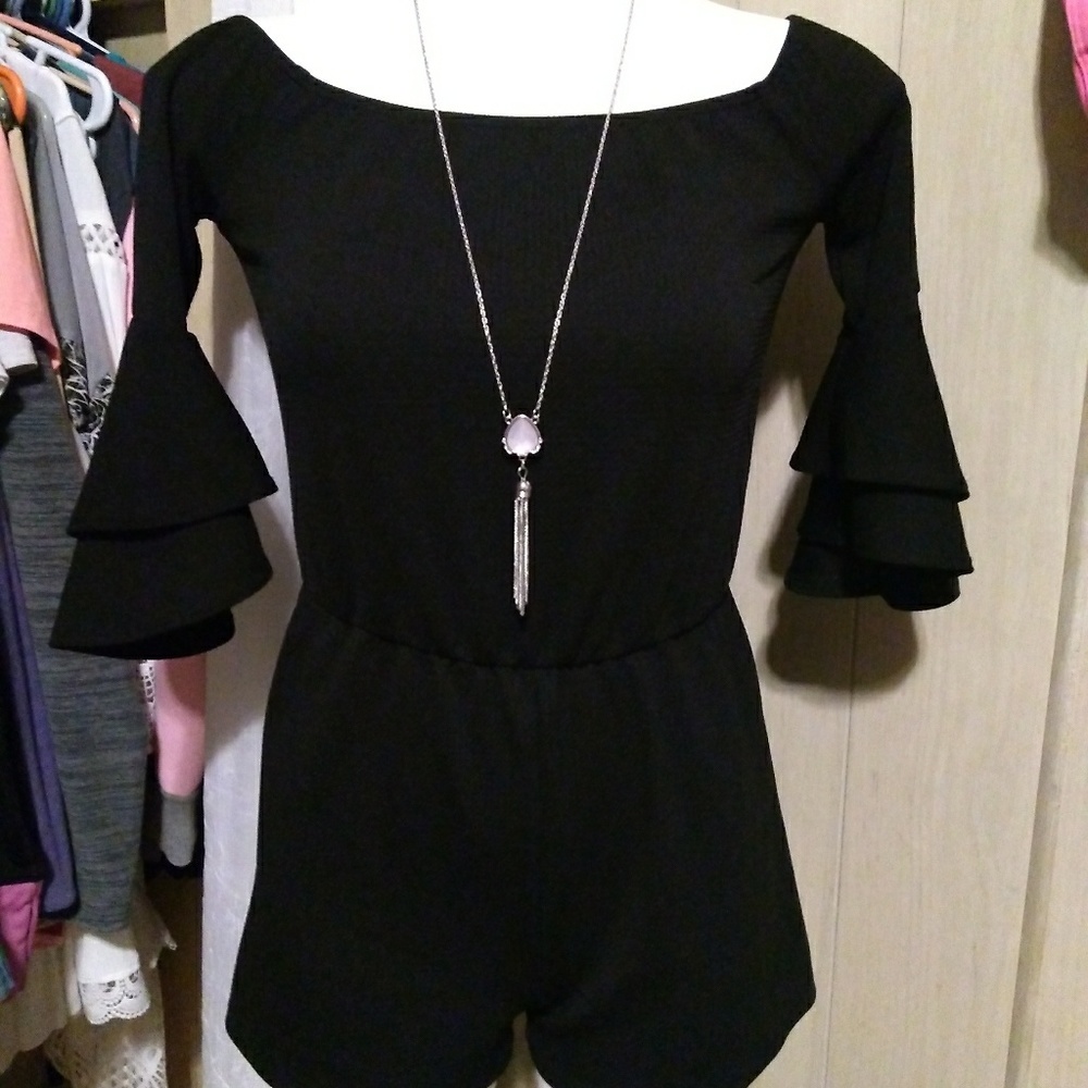 Black romper fits small